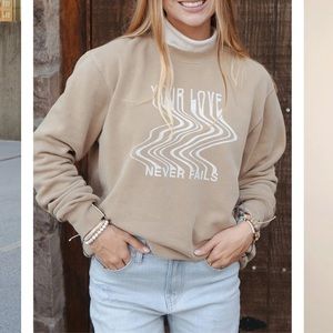 Elevated faith love never fails unisex crewneck / sweatshirt in tan sz small
